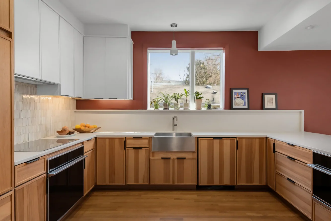 View of kitchen sink, new window, hickory cabinets and handmade moroccan "zellige" tile backsplash