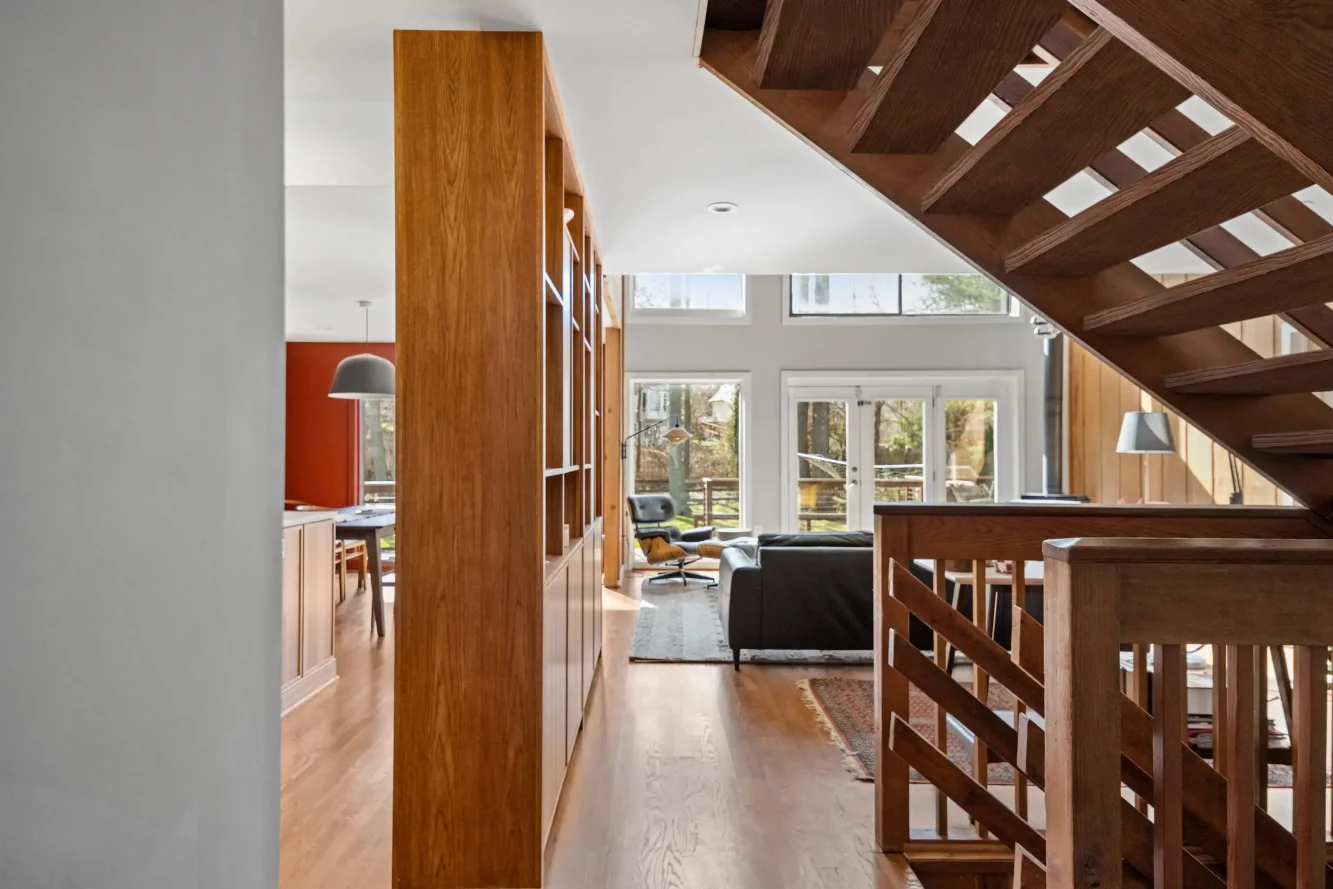 View to two story living room through floating stair 