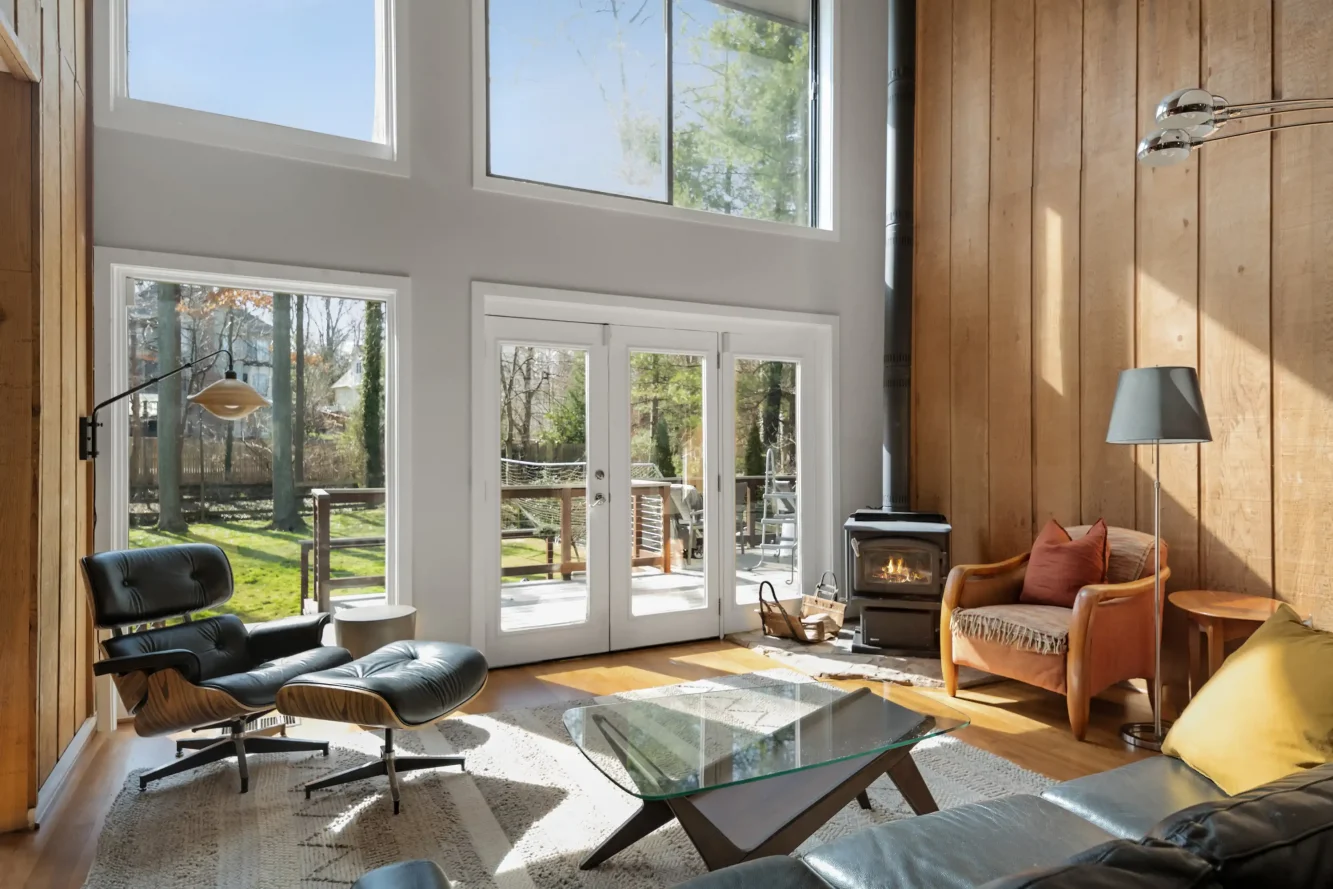 View of living room showing wood stove and comfortable conversation area 