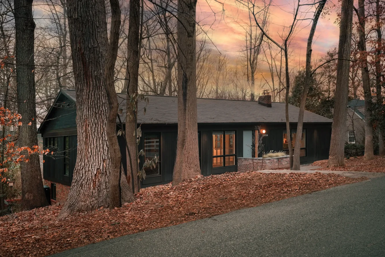 View from the street of the newly renovated home. Included in the entirely new exterior envelope are are custom milled cypress nickel gap cladding, new enlarged windows, and turned front entry stair and landing